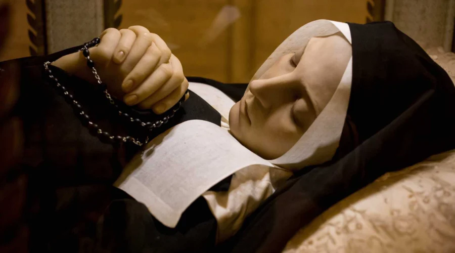bernadette-rosary-lourdes St Bernadette with rosary in repose at Lourdes pilgrimage tour